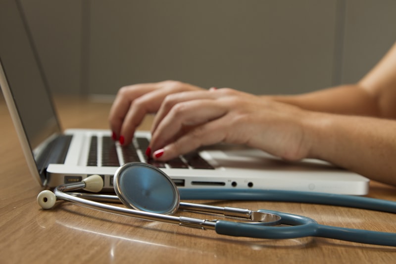 Healthcare professional supporting a patient in a care setting
